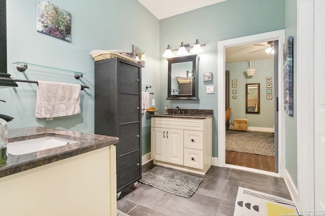 bathroom featuring vanity, hardwood / wood-style floors, and ceiling fan