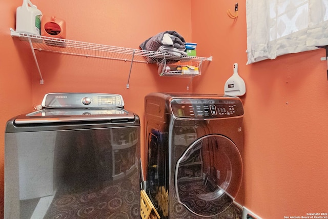 laundry room featuring washing machine and clothes dryer