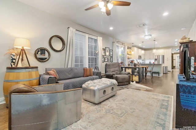 living room featuring ceiling fan