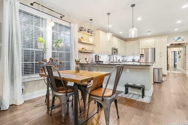 dining area with light wood-type flooring