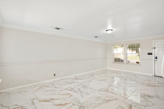 spare room featuring crown molding