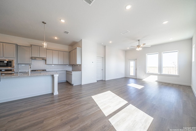 10280 Bartenheim Dr, Schertz, TX 78154 - kitchen featuring stainless steel appliances, gray cabinetry, backsplash, a ceiling fan, and recessed lighting