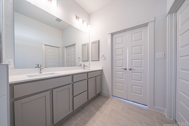10280 Bartenheim Dr, Schertz, TX 78154 - bathroom with double vanity and tile patterned floors