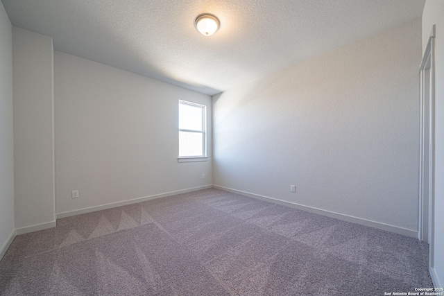 10280 Bartenheim Dr, Schertz, TX 78154 - empty room with carpet flooring, a textured ceiling, and baseboards