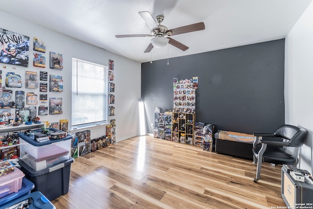 miscellaneous room with ceiling fan and hardwood / wood-style floors