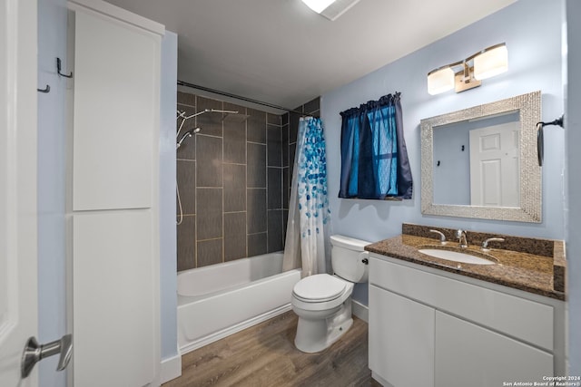 full bathroom with shower / bath combination with curtain, wood-type flooring, vanity, and toilet