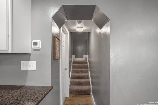 stairway featuring hardwood / wood-style flooring