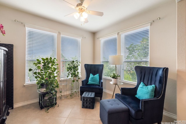 sitting room with ceiling fan and light tile patterned floors