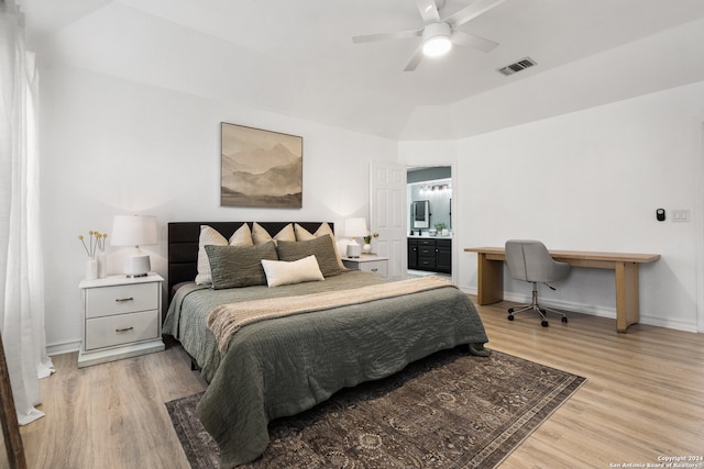 bedroom featuring ceiling fan, ensuite bathroom, and light hardwood / wood-style floors