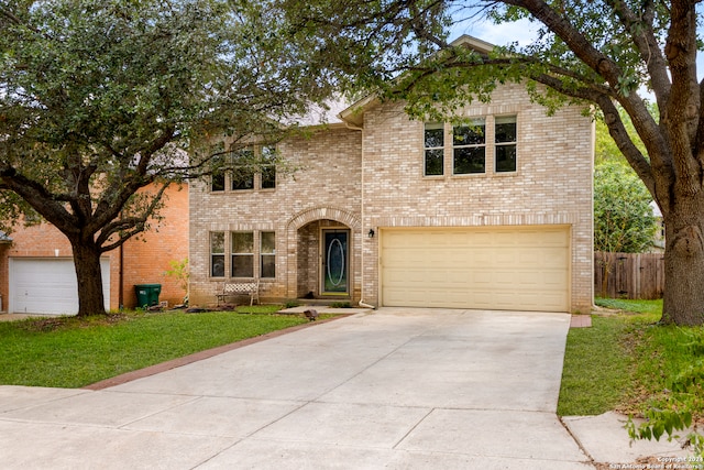 view of front property with a garage and a front yard