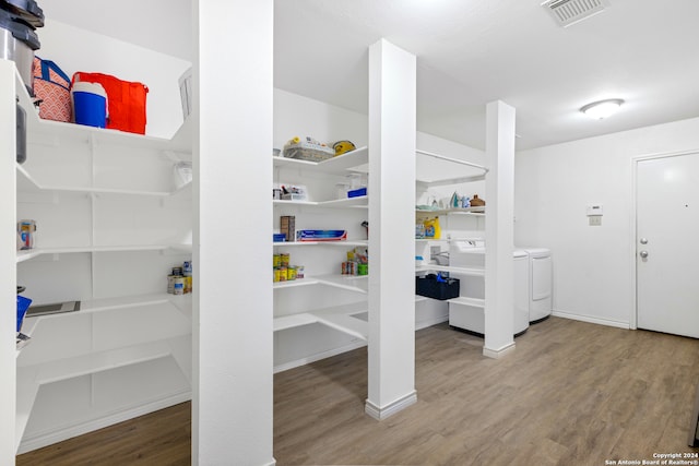 pantry with separate washer and dryer