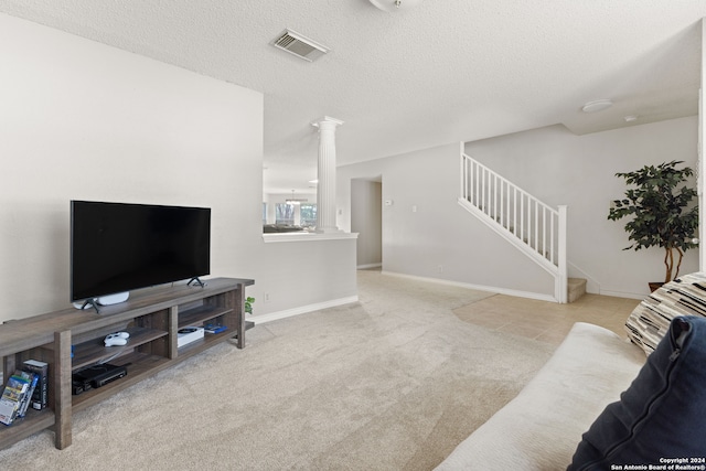 carpeted living room featuring a textured ceiling