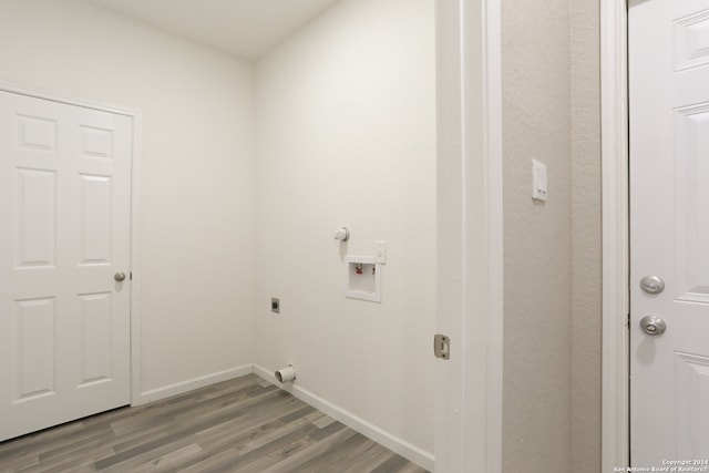 washroom featuring hookup for a washing machine, hardwood / wood-style floors, and hookup for an electric dryer