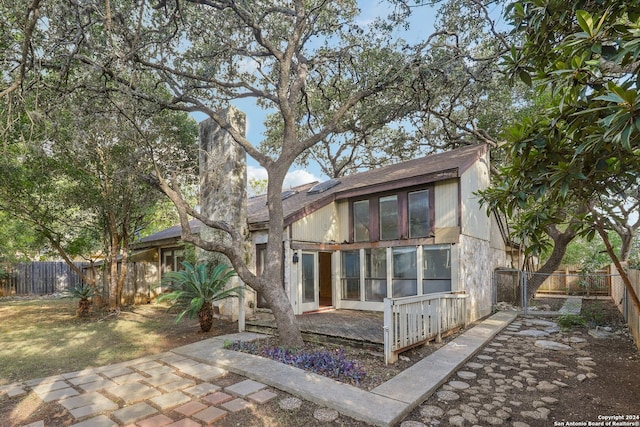 back of property featuring a patio