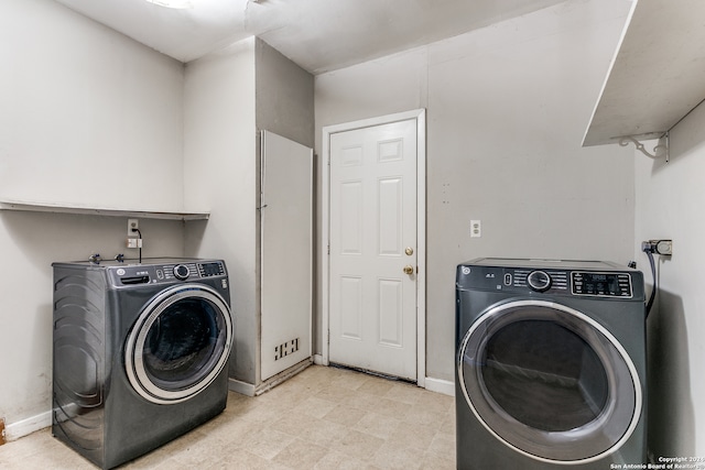 washroom with washer and dryer