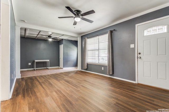 interior space with beam ceiling, hardwood / wood-style flooring, and ceiling fan