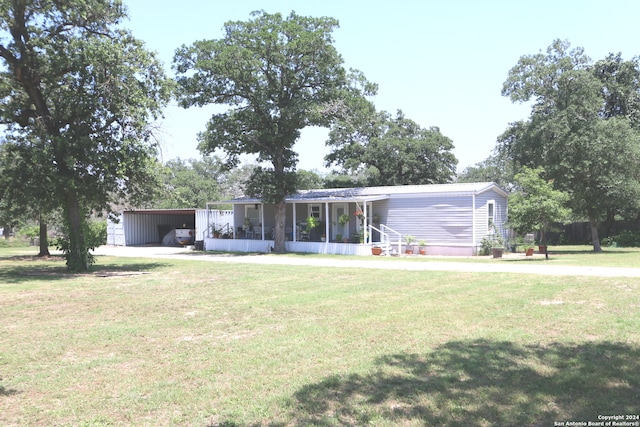 view of front of house featuring a front yard and a porch