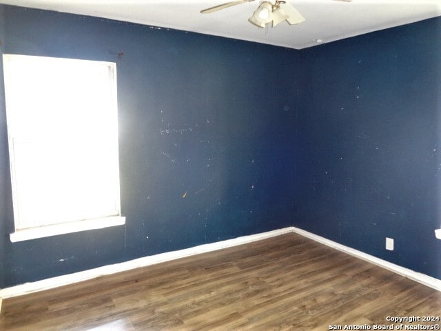 spare room featuring ceiling fan and hardwood / wood-style flooring