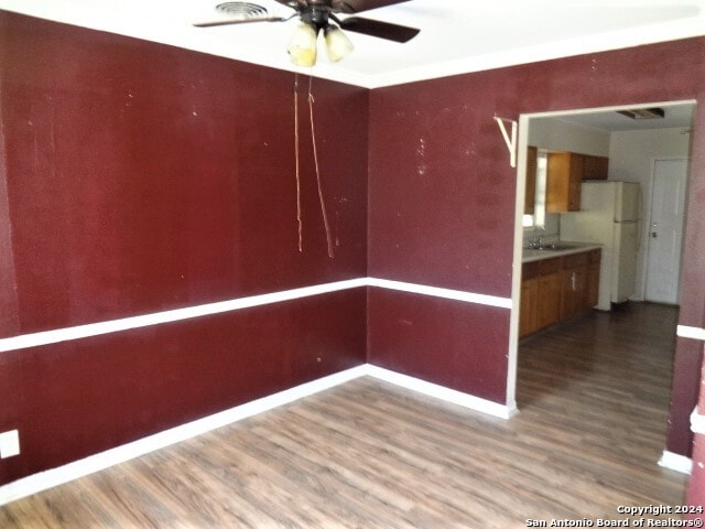 spare room with ceiling fan and hardwood / wood-style floors