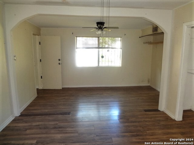 unfurnished dining area featuring dark hardwood / wood-style floors and ceiling fan