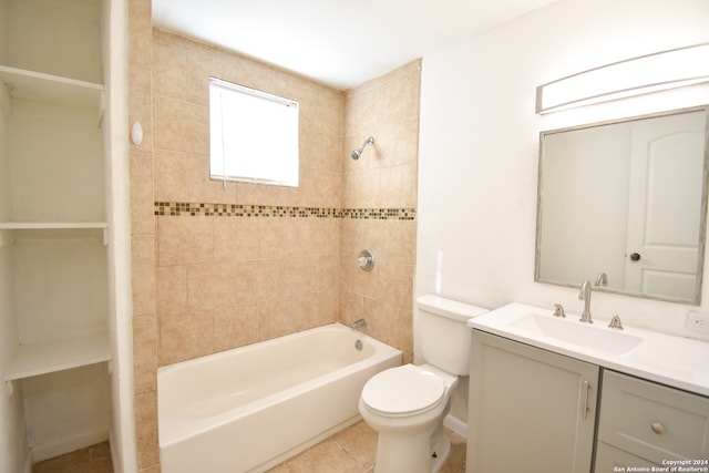 full bathroom with vanity, toilet, tiled shower / bath combo, and tile patterned flooring