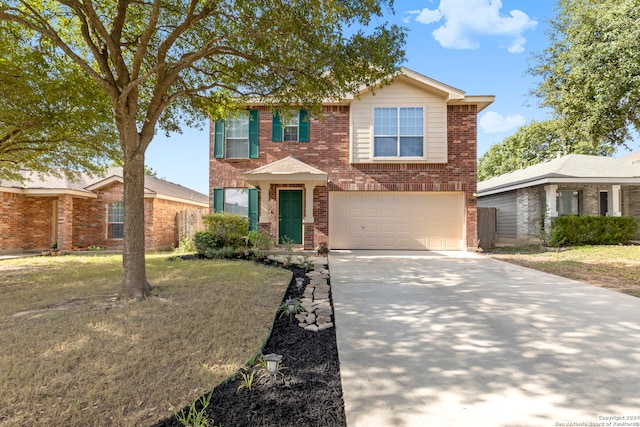 view of front of home featuring a front yard and a garage