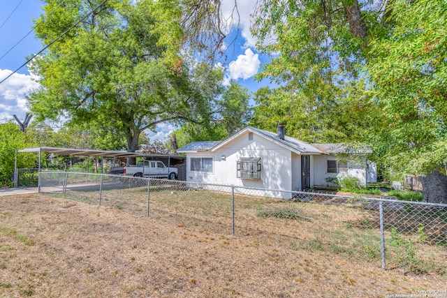 view of front facade with a carport