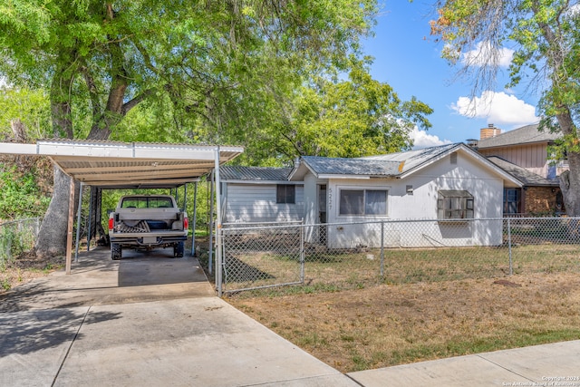 exterior space featuring a carport