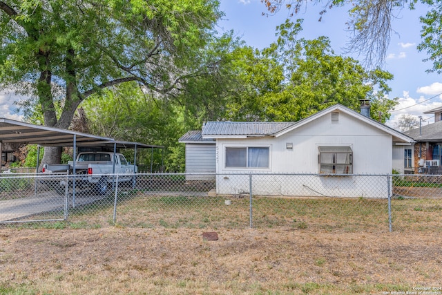 view of side of property with a yard