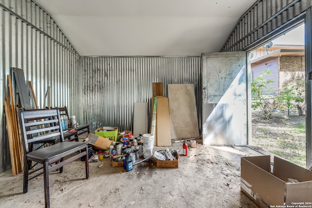 miscellaneous room with lofted ceiling