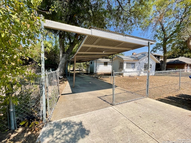 view of vehicle parking with a carport