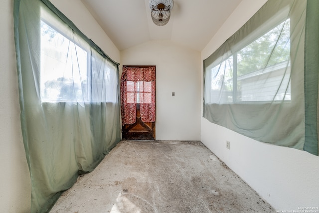 spare room featuring vaulted ceiling