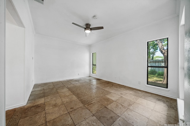 empty room with crown molding and ceiling fan