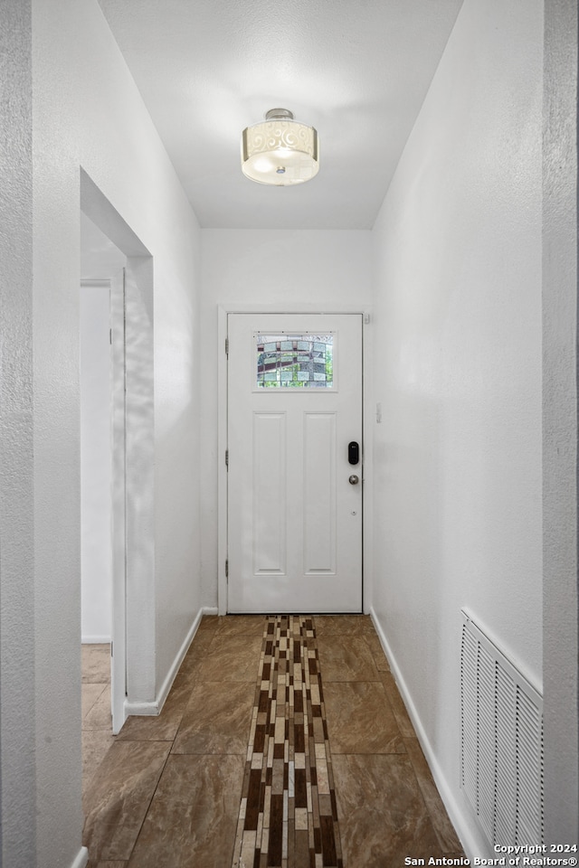 entryway featuring tile patterned flooring