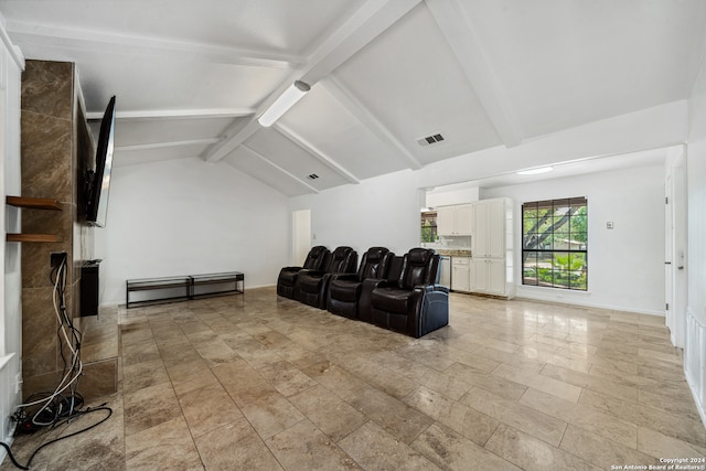 living room featuring vaulted ceiling with beams