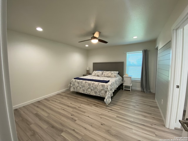 bedroom featuring light wood-type flooring and ceiling fan