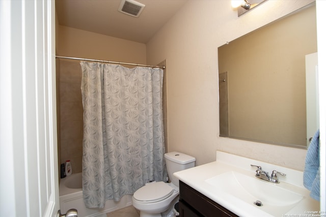 full bathroom with shower / bath combo with shower curtain, vanity, and toilet