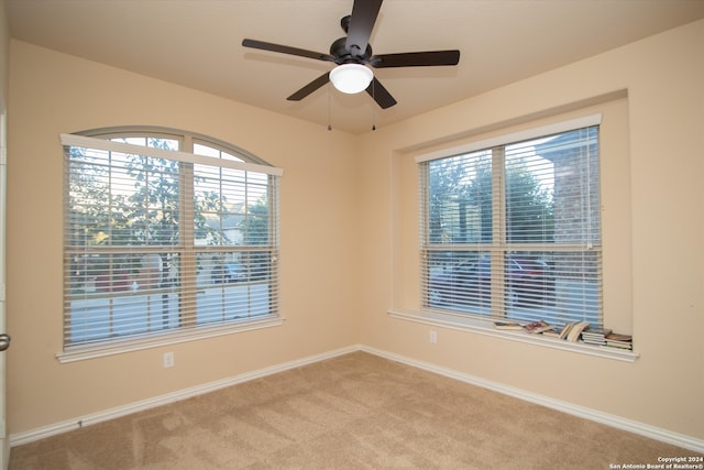 carpeted empty room with ceiling fan