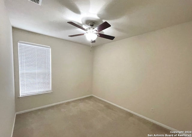 carpeted empty room with ceiling fan