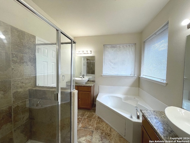 bathroom with plus walk in shower and vanity