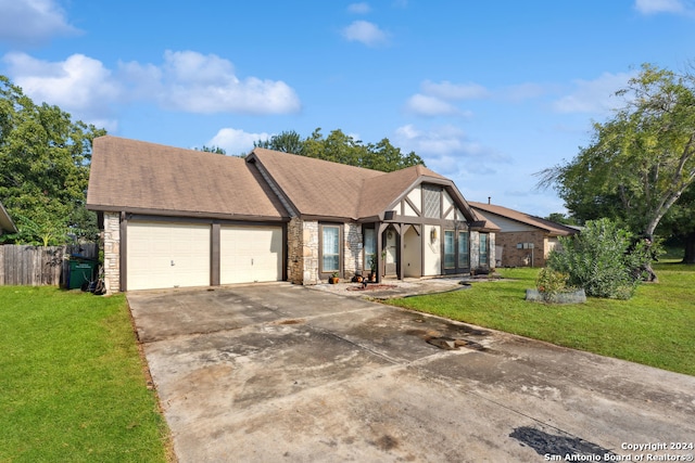 view of front of home featuring a front yard and a garage