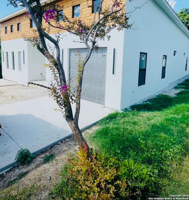 view of property exterior featuring a garage