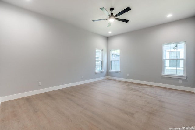 spare room with ceiling fan and light hardwood / wood-style floors