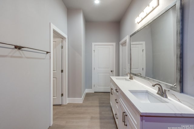 bathroom featuring hardwood / wood-style floors and vanity