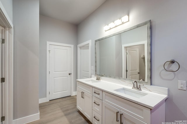 bathroom featuring hardwood / wood-style flooring and vanity