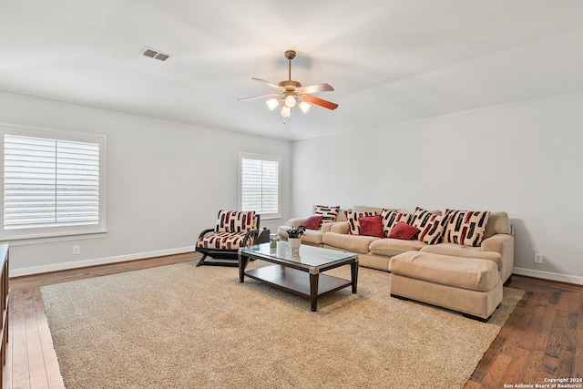 living room with wood-type flooring and ceiling fan