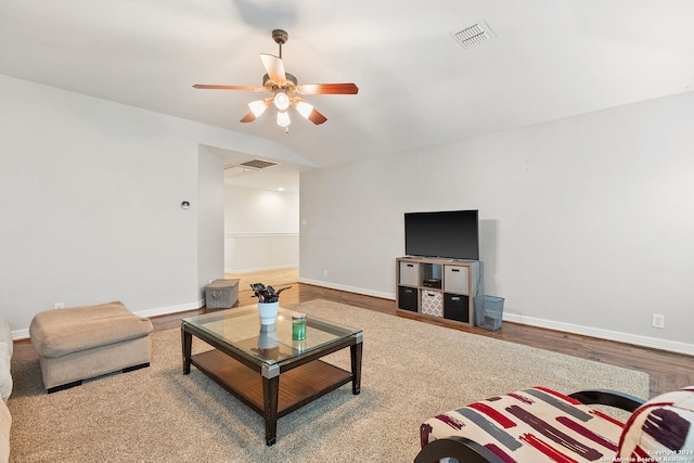 living room featuring hardwood / wood-style floors and ceiling fan