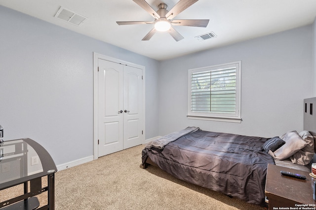 carpeted bedroom with a closet and ceiling fan