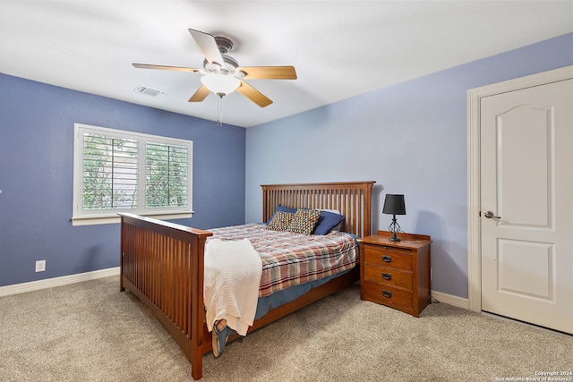 carpeted bedroom with ceiling fan