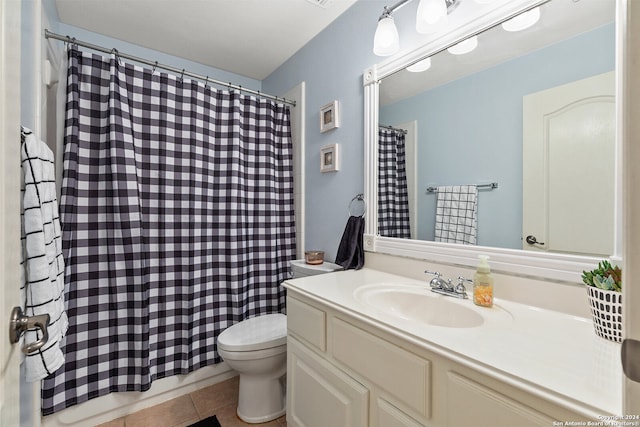 bathroom featuring tile patterned floors, a shower with curtain, vanity, and toilet